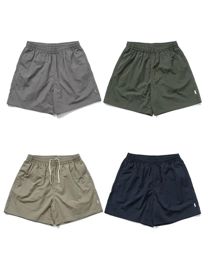 MADNESS NYLON SHORTS Short de plage ample décontracté à quatre points de style américain à séchage rapide