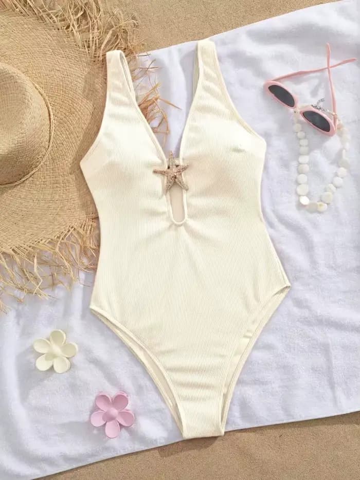 Maillot de bain une pièce rose 2026 pour femme, orné d'une étoile de mer métallique, décolleté en V