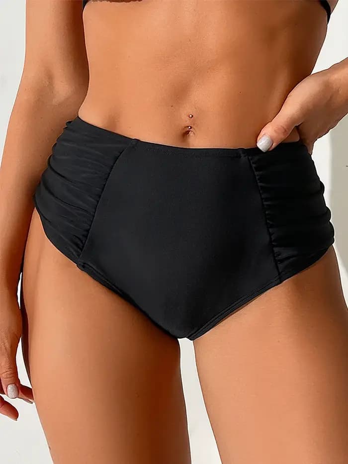 Bas de bikini femme : pantalon taille haute noir avec coutures et plis latéraux.