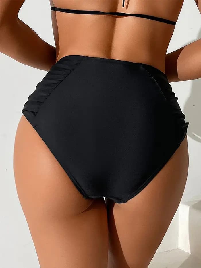 Bas de bikini femme : pantalon taille haute noir avec coutures et plis latéraux.